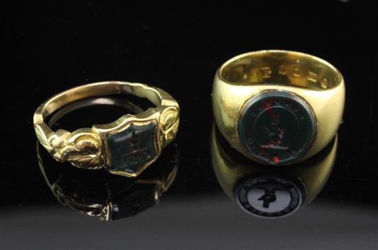 Two late 19th/early 20th century gold and bloodstone set signet rings, size L.